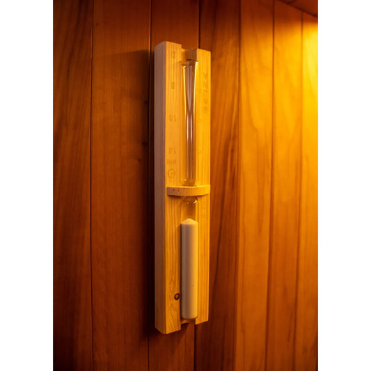 Wooden sauna wall with sand timer