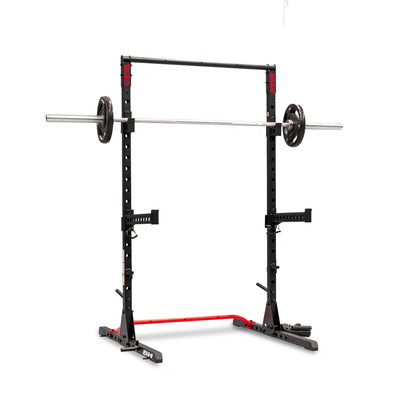 Black and red power rack with barbell and weights on a white background