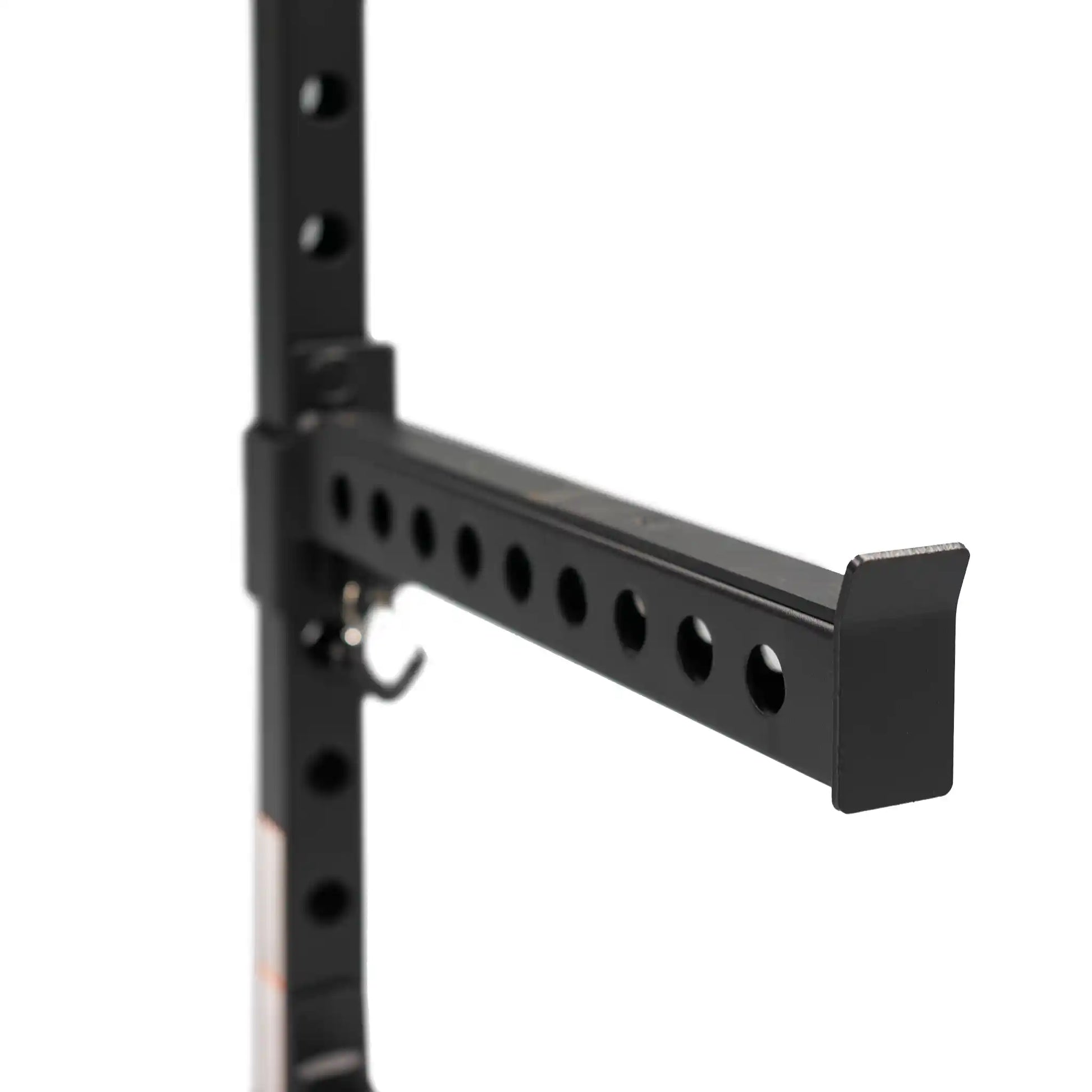 Safety bar on black power rack
