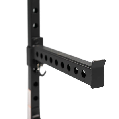 Safety bar on black power rack
