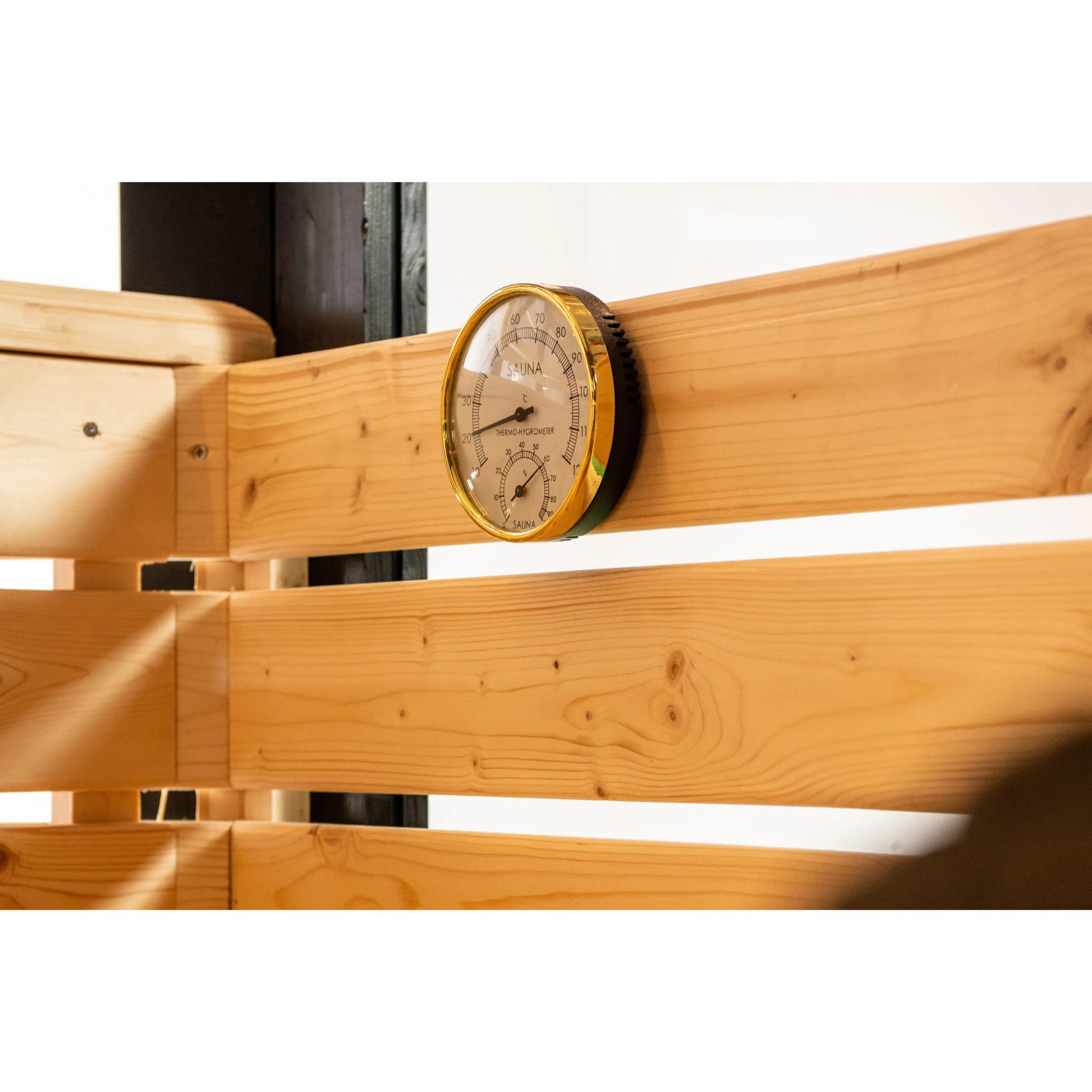 Wooden beam with a circular temperature gauge