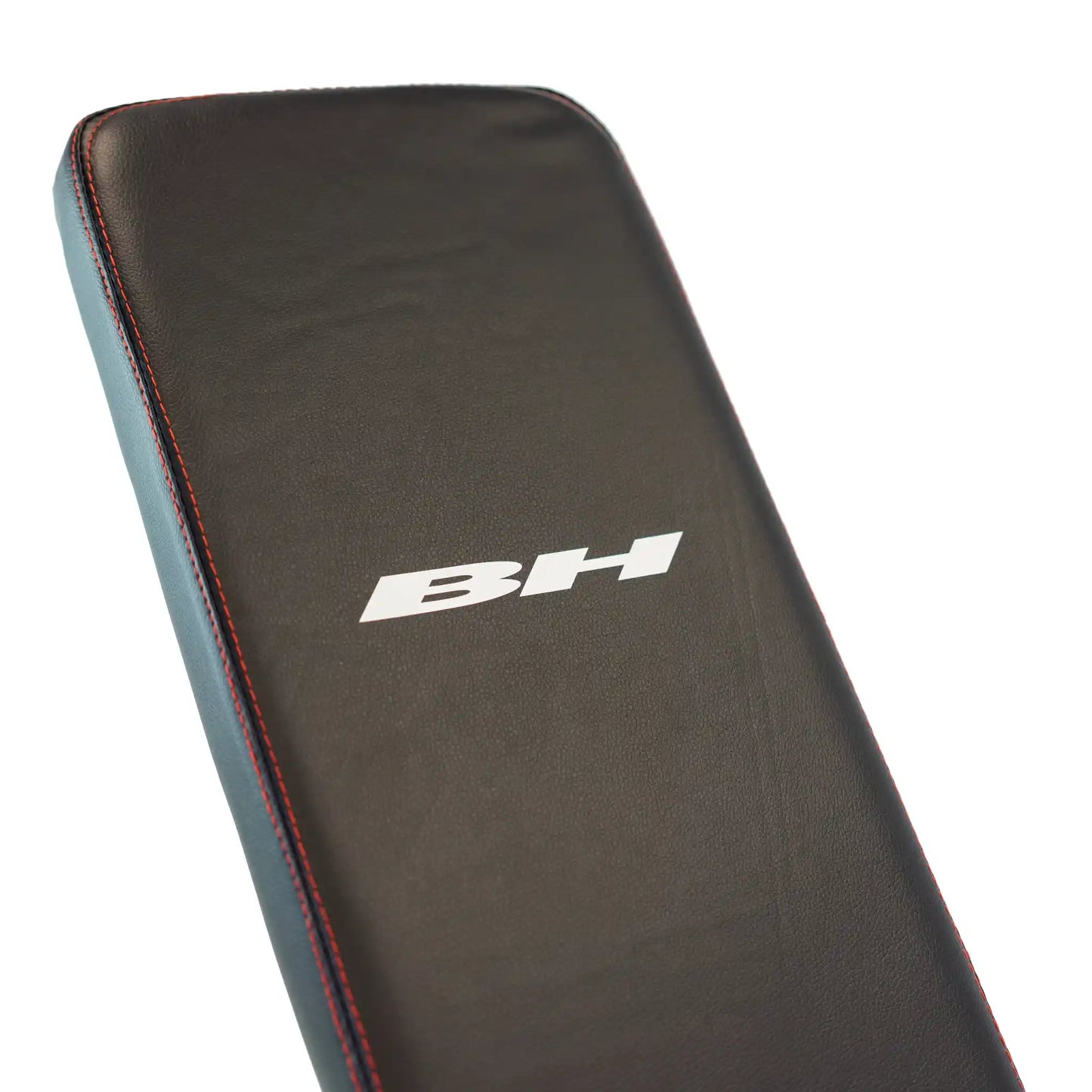 Back support with BH branding on a weight bench