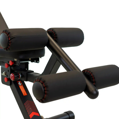 Leg extension on a black gym bench