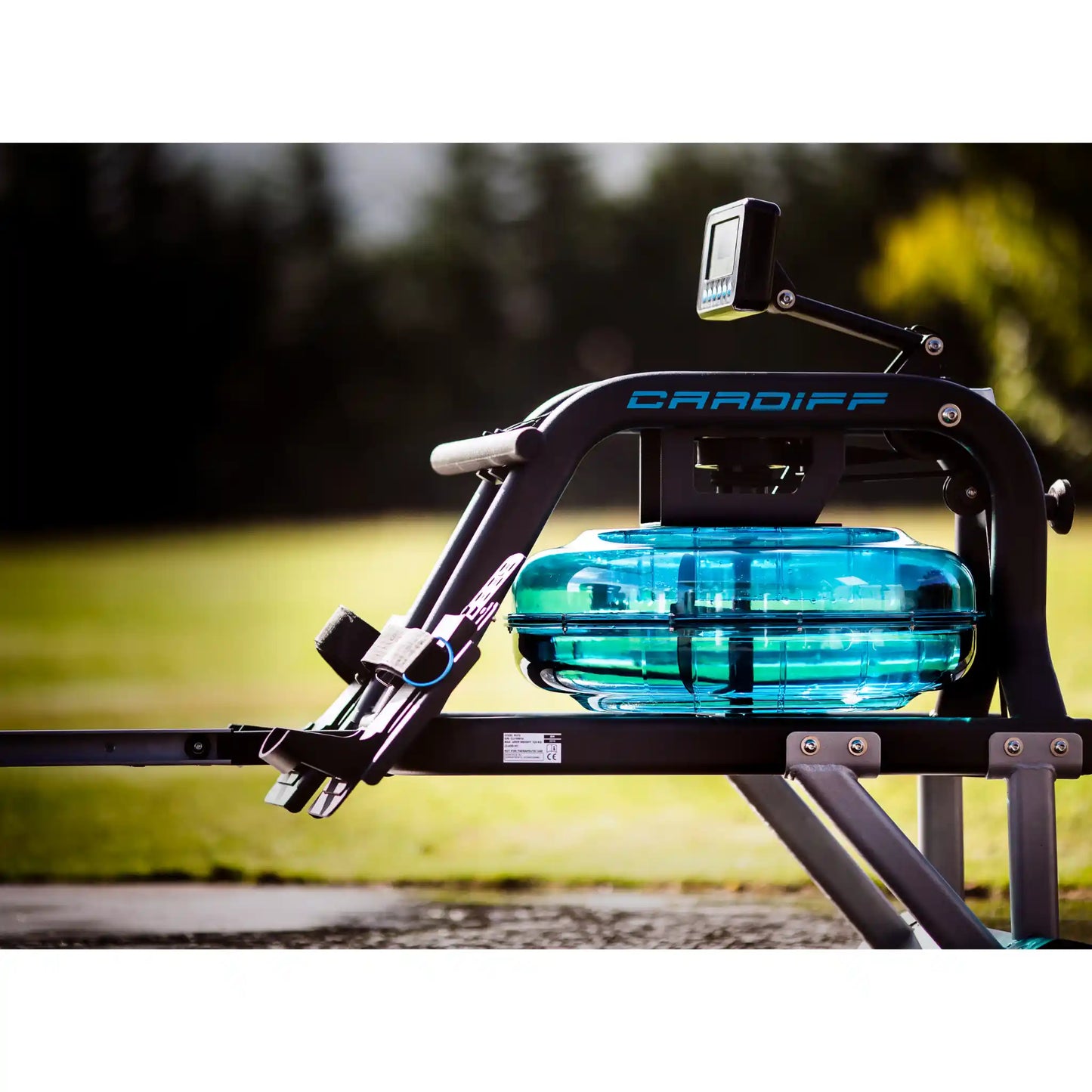 Rowing machine with a water rowing system on a blurred outdoor background