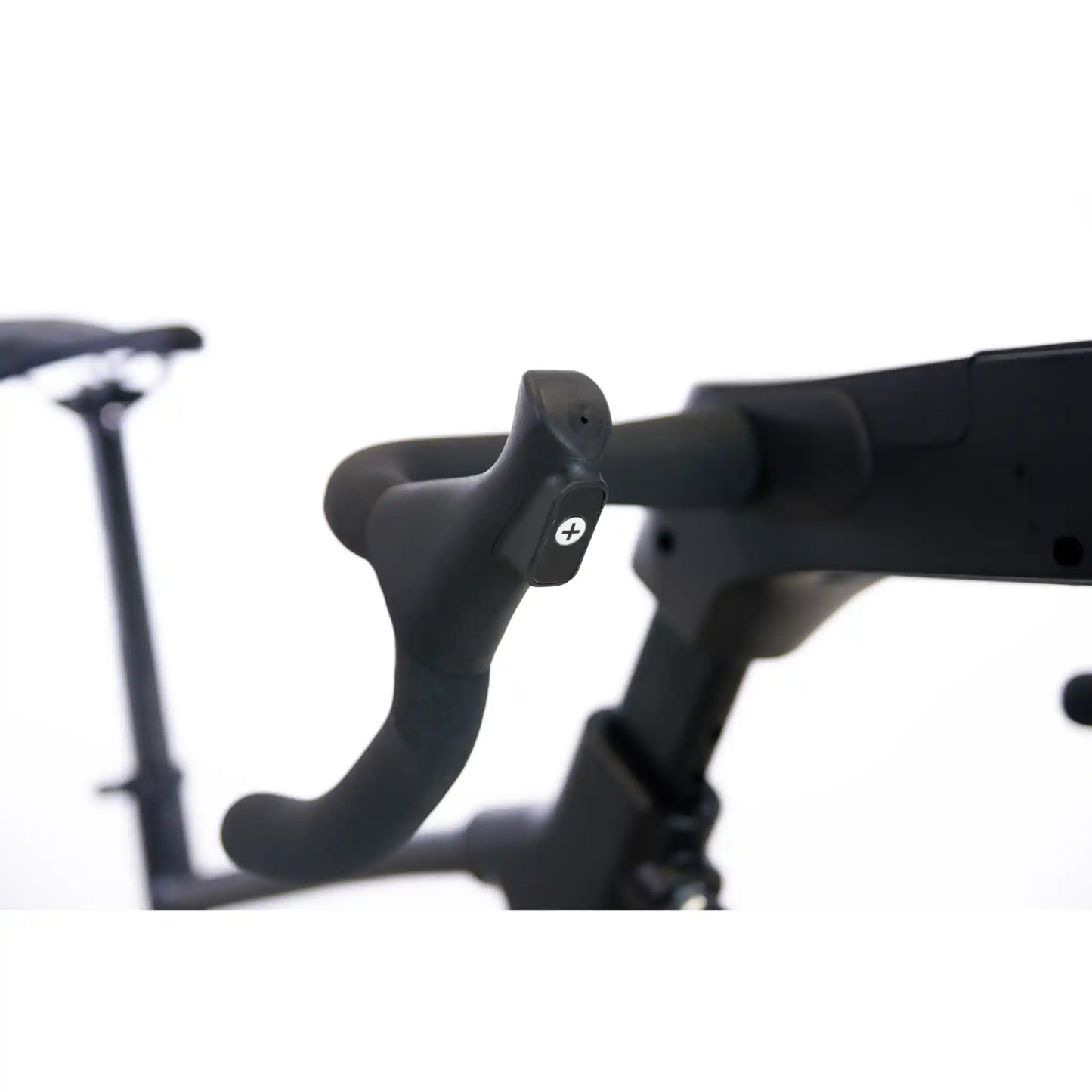 Close-up of a black bicycle handlebar with a blurred background