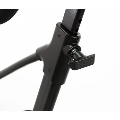 Close-up of a black adjustable exercise bike stand on a white background