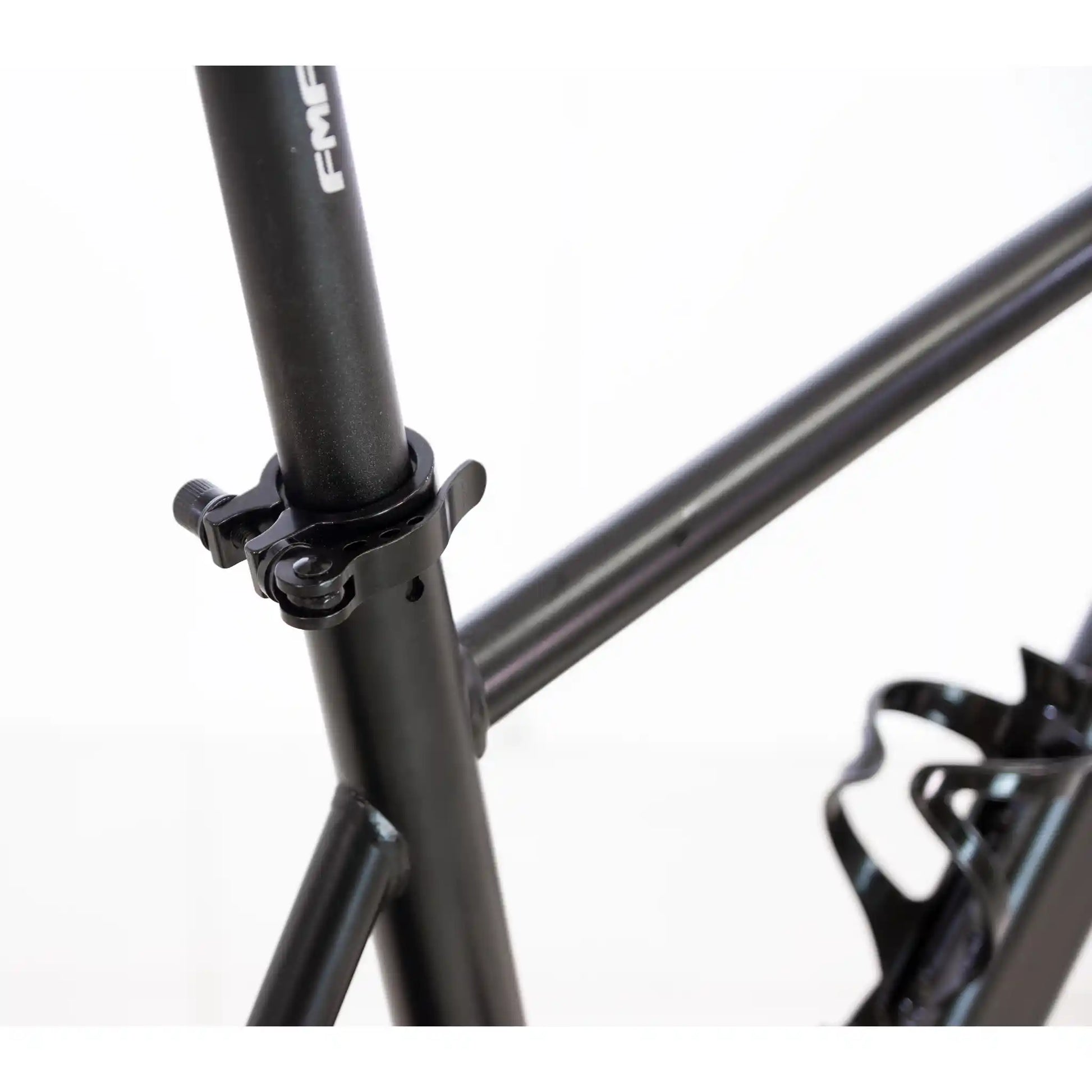 Close-up of a black bicycle frame with branding on a white background
