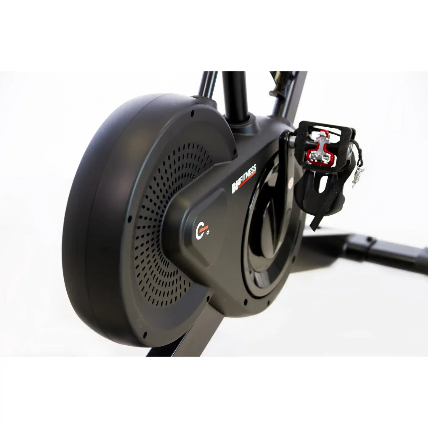 Close-up of a stationary bike's gear system on a white background