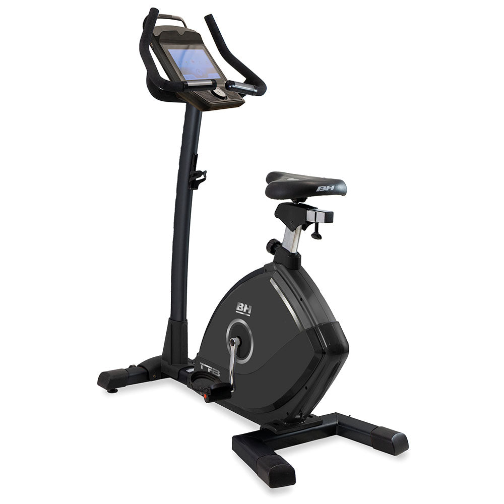 Black exercise bike with digital display on a white background