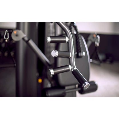 Close-up of multi gym handles and control levers with a blurred background