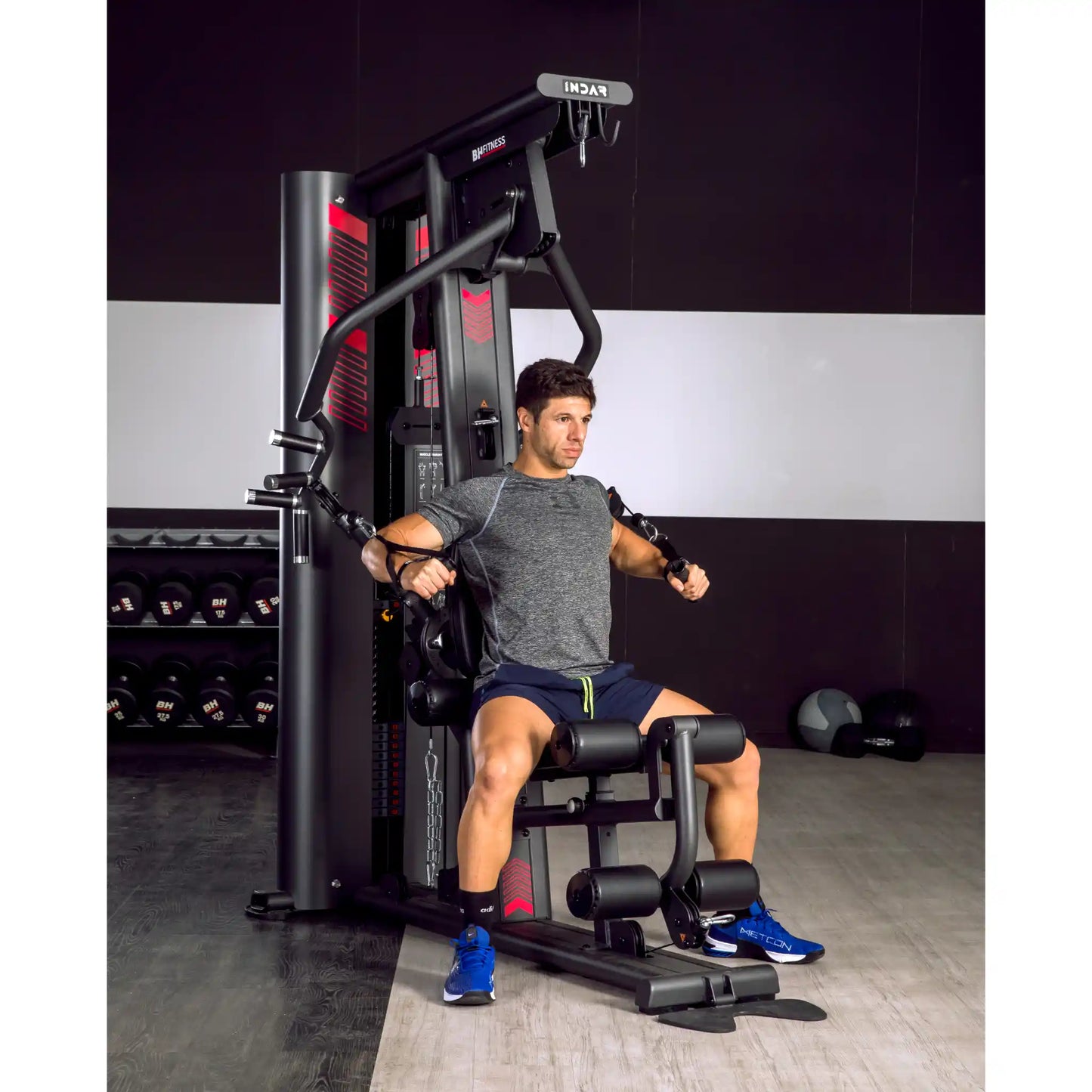 Man using chest press function on a multi gym