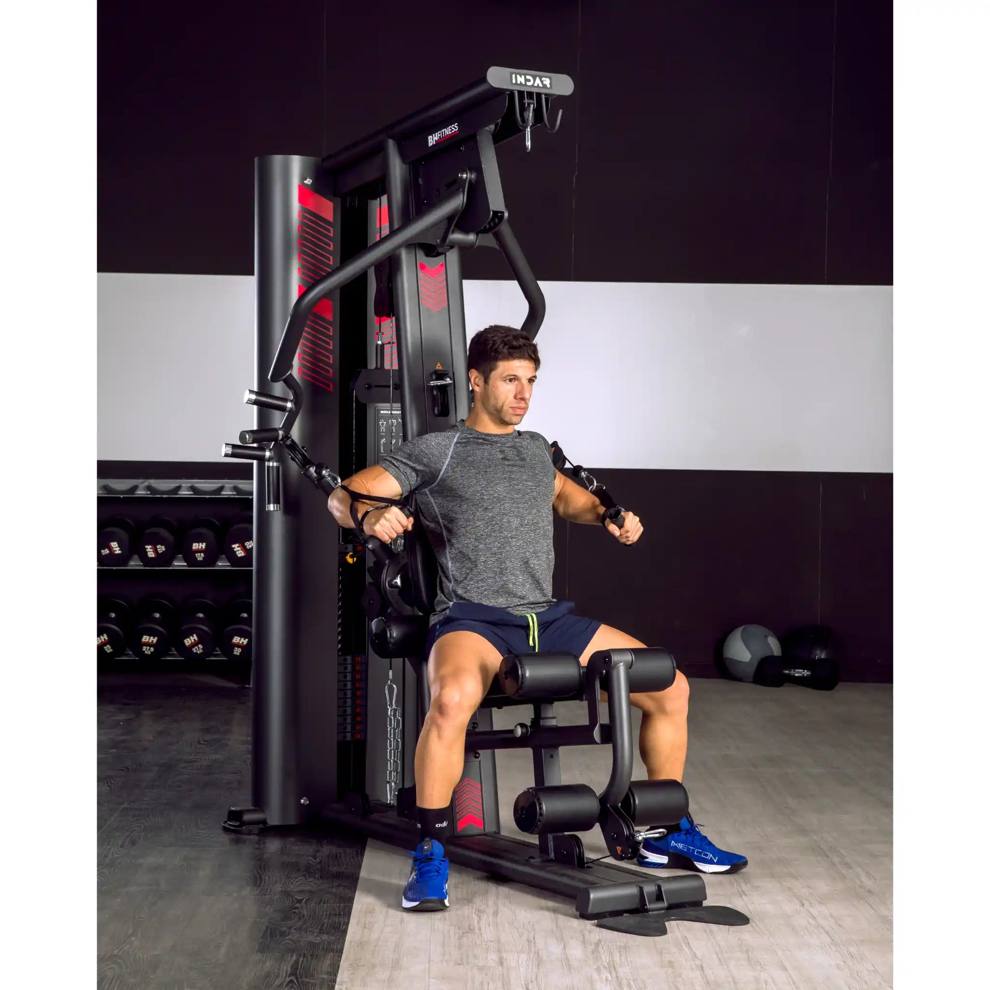 Man using chest press function on a multi gym