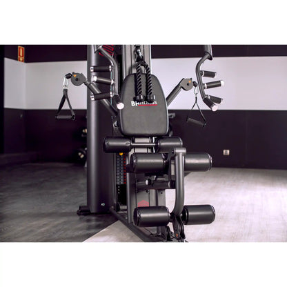 Multi Gym machine with 'BH Fitness' branding in a gym setting