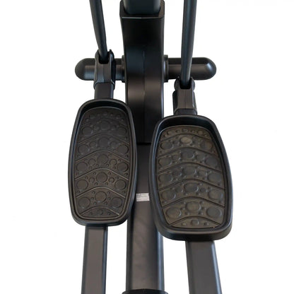 Close-up of black cross trainer machine pedals on a white background