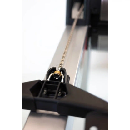Close-up of a mechanical component with a chain on a white background
