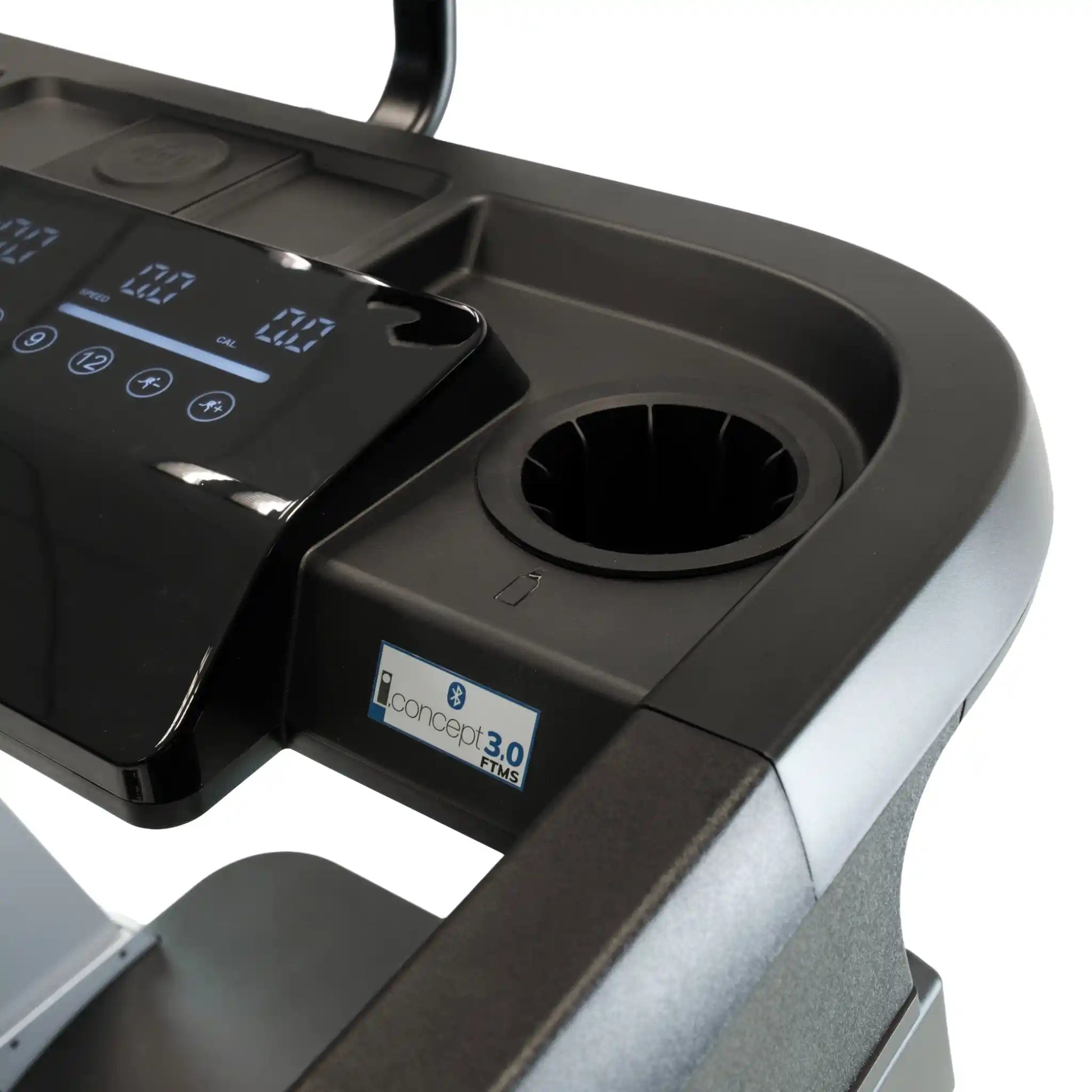 Close-up of a treadmill with a digital display and cup holder on a white background