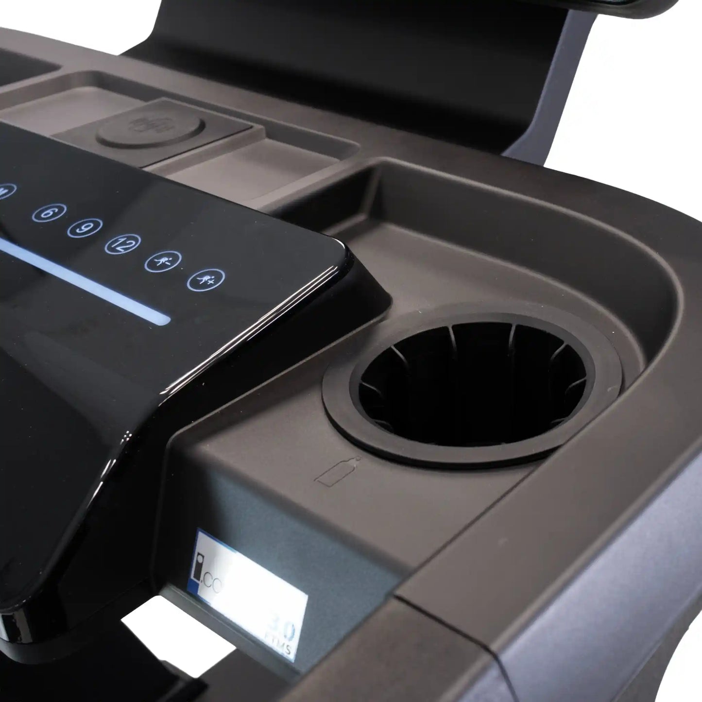 Close-up of bottle holder and smartphone charging station on treadmill