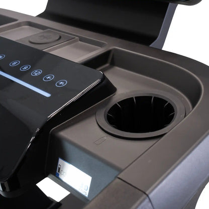 Close-up of bottle holder and smartphone charging station on treadmill