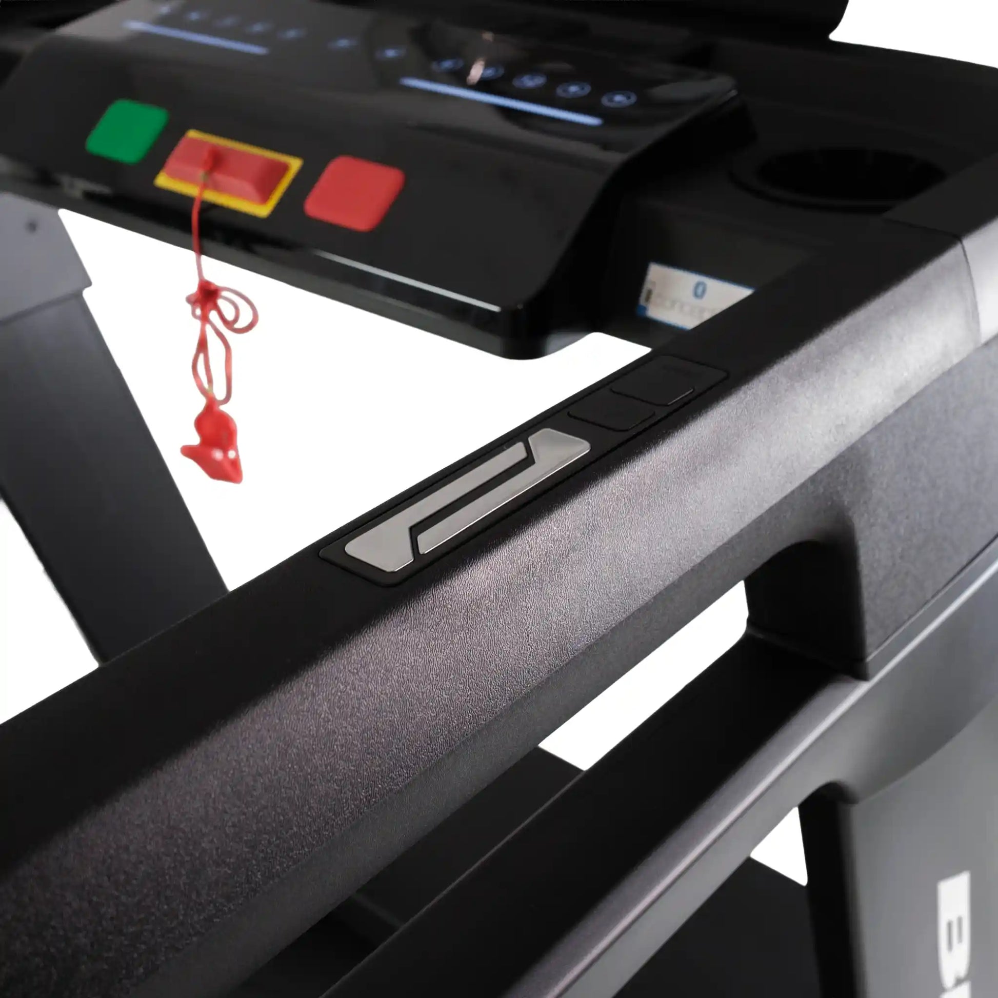 Close-up of a treadmill control panel with buttons and display.