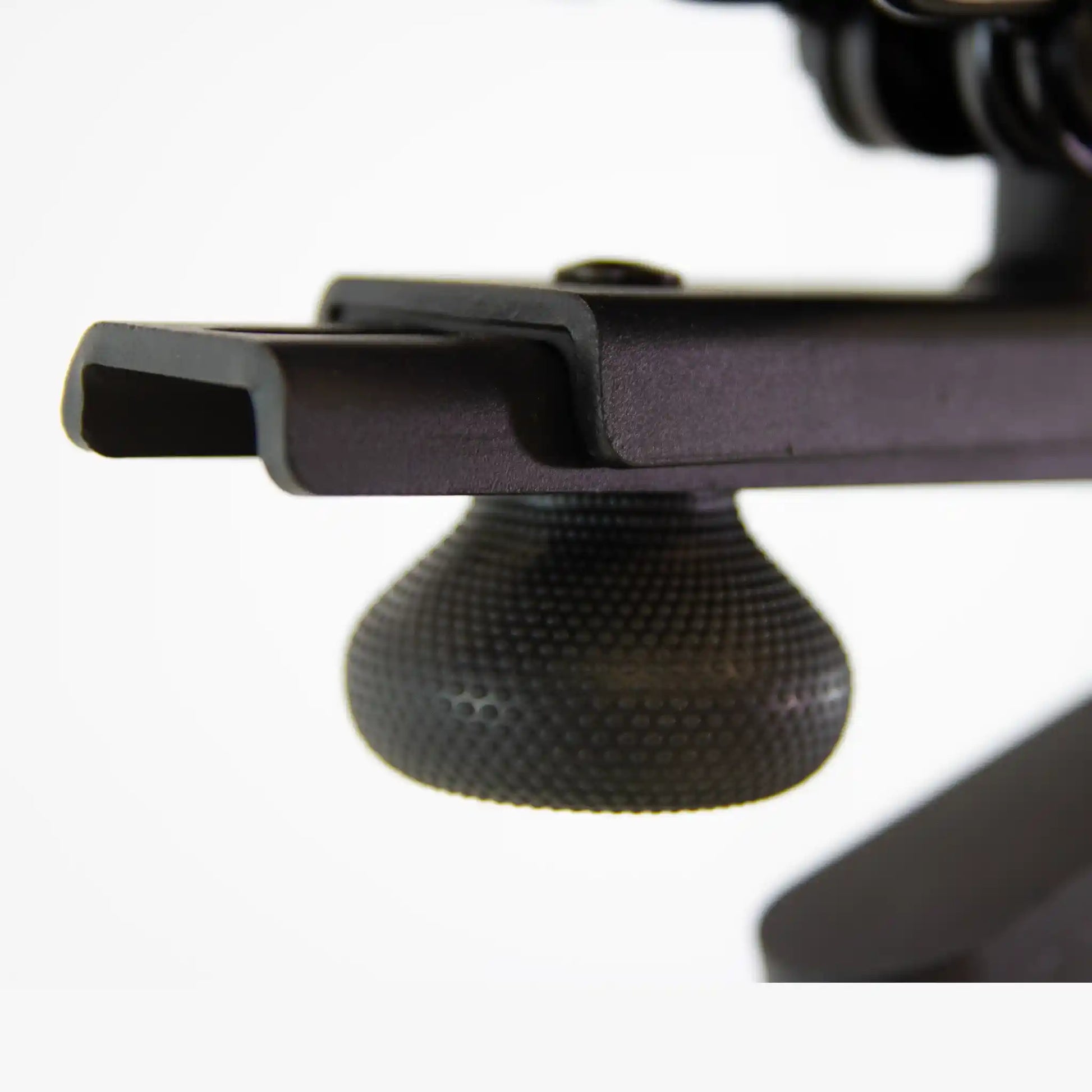 Close-up of a black seat adjuster white background