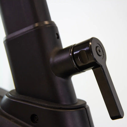 Close-up of a black adjustable stand with a lever on a white background