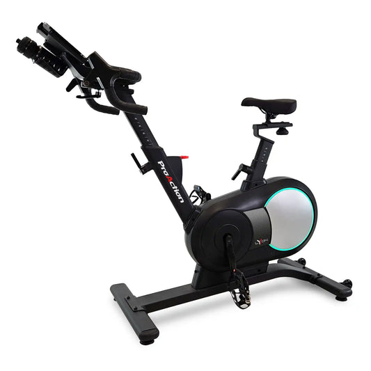 Black exercise bike with digital display on a white background
