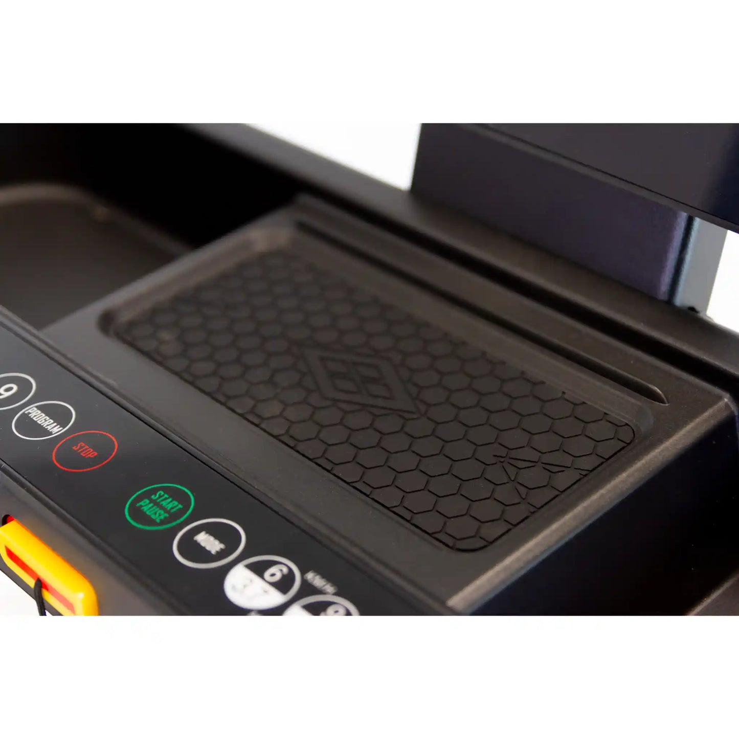 Control panel with buttons and a textured black surface