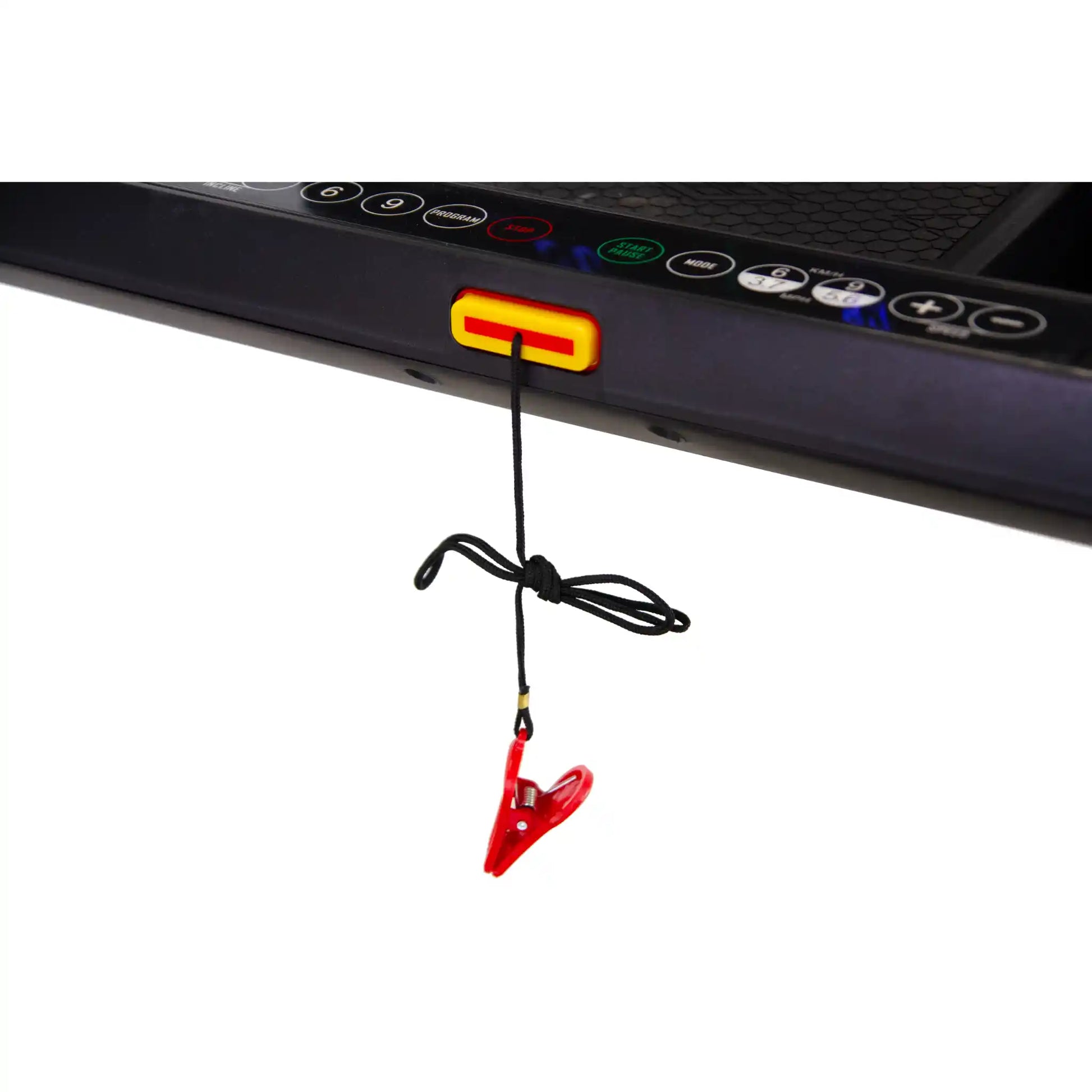 Red clip with a black cord attached to a treadmill control panel on a white background