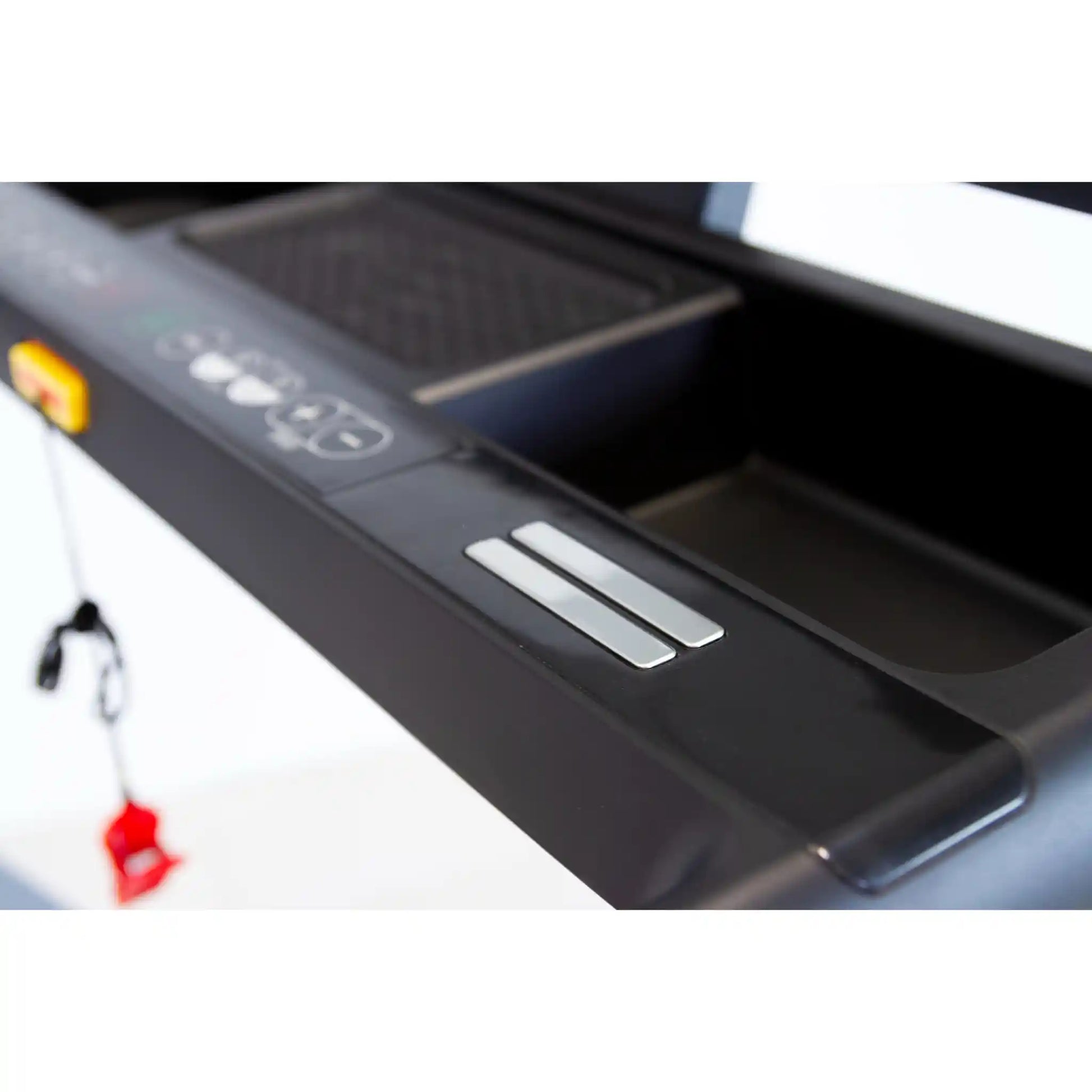 Close-up of a treadmill with control panel and display on a white background