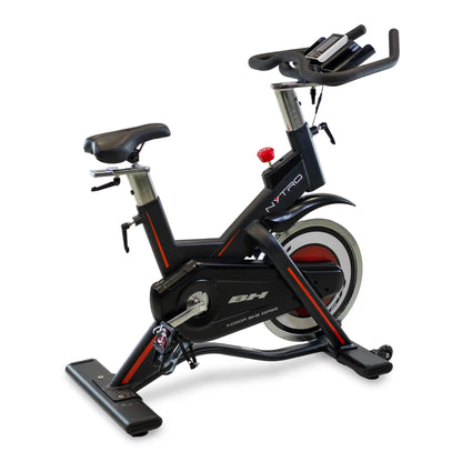 Black and red exercise bike on a white background