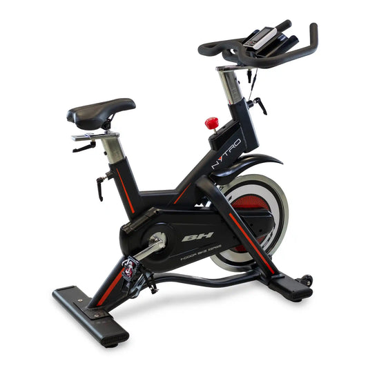 Black and red exercise bike on a white background