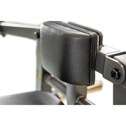 Close-up of a gym machine with a black arm pad on a white background