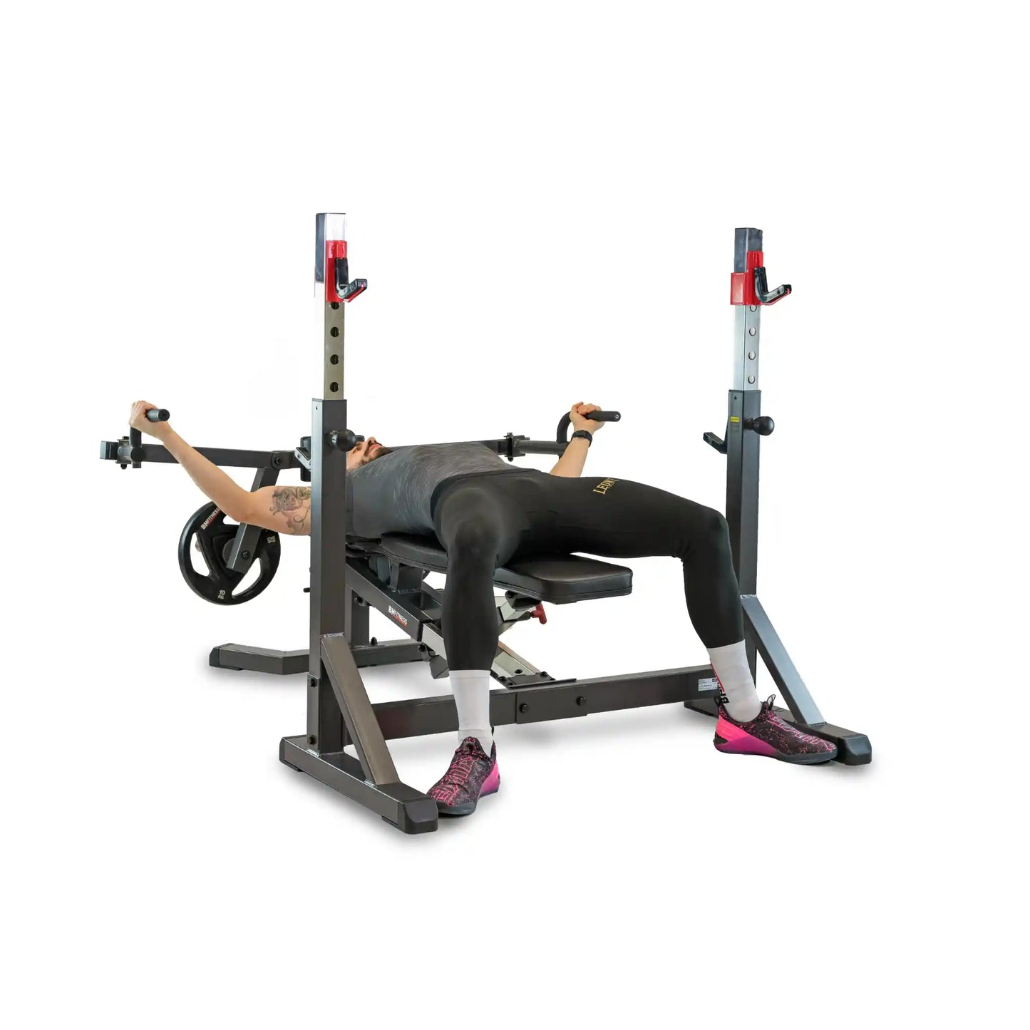 Person using a weight lifting bench and rack on a white background