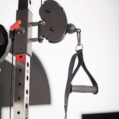 Close-up of a weightlifting pulley system with a strap attachment on a white background