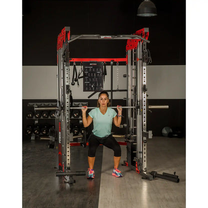Woman using a Smith machine in a gym setting