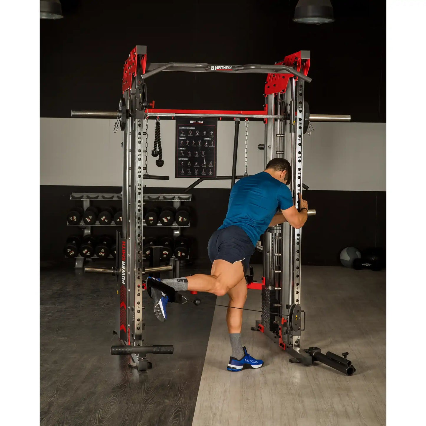 Person using a pulley machine in a gym setting