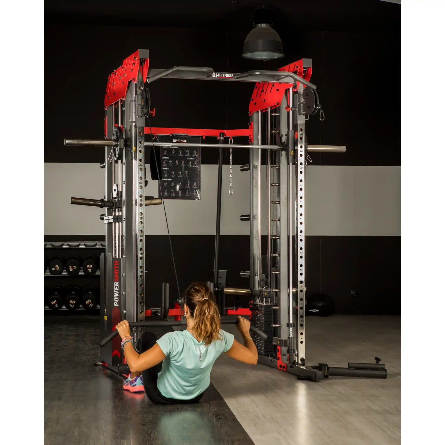 Person using a cable machine in a gym setting