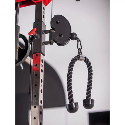 Rope attached to pulley system on multi gym with a white background