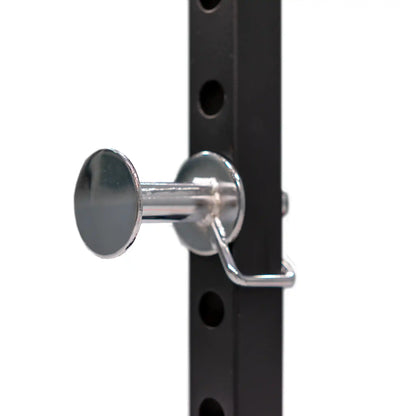 Metal lock mechanism on a black metal power cage frame
