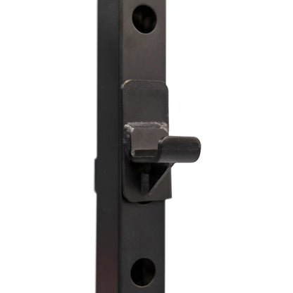 Black metal power cage hook on a white background
