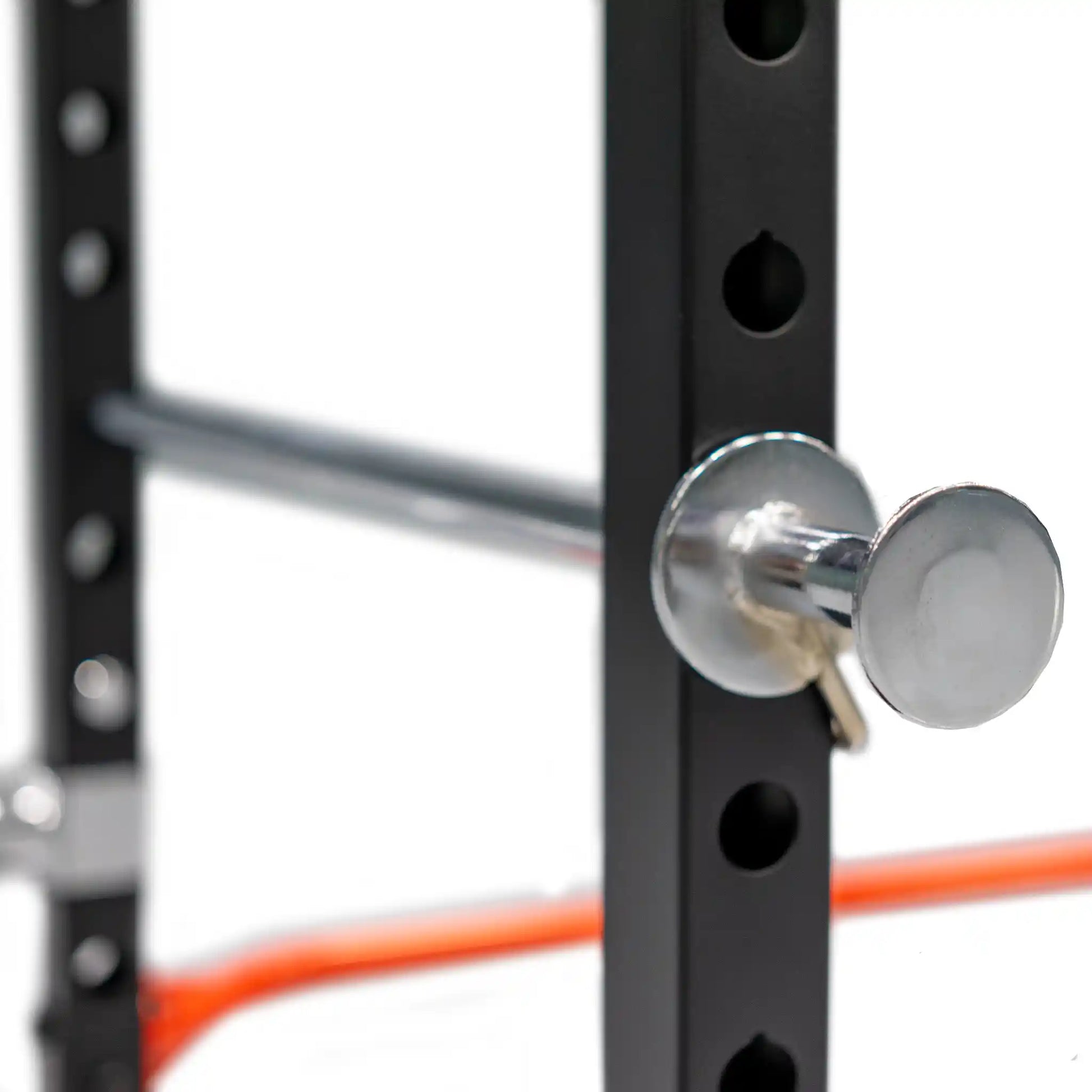 Close-up of a metal bar with a red bar on a white background