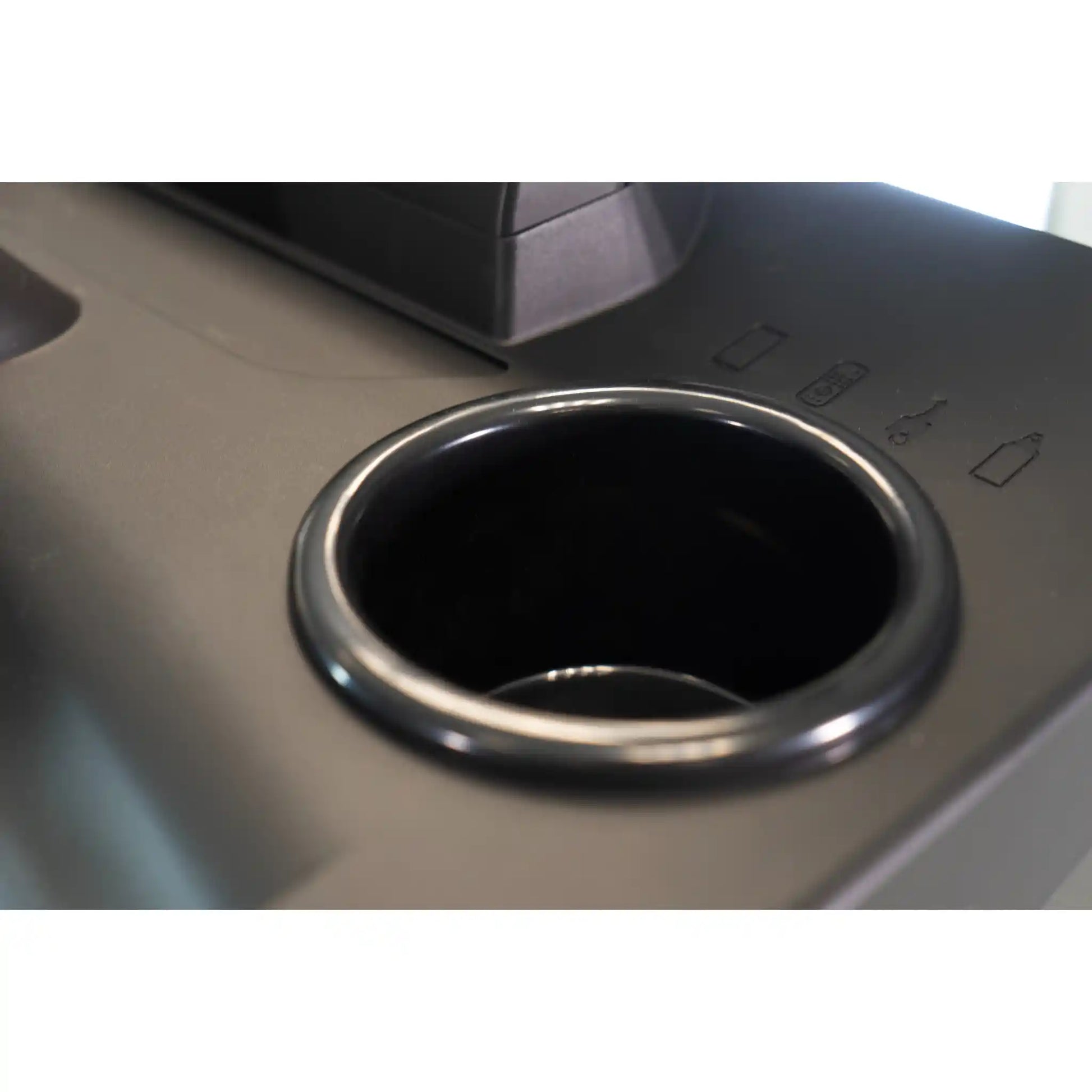 Close-up of a car cup holder on treadmill