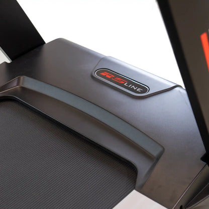Close-up of a treadmill motor cover with 'RS Line' logo on a white background