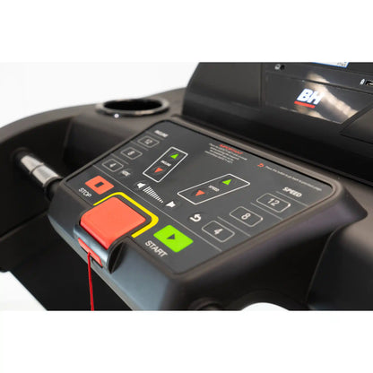 Control panel of a treadmill with digital display and buttons.
