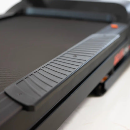 Close-up of a treadmill with a blurred background