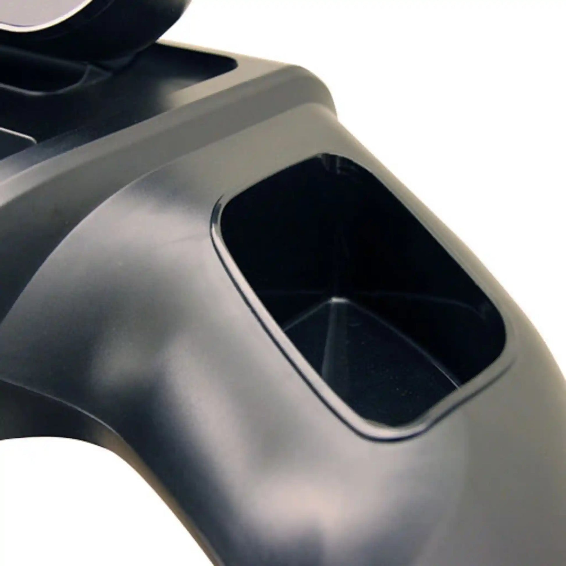Close-up of storage space on a treadmill with a white background