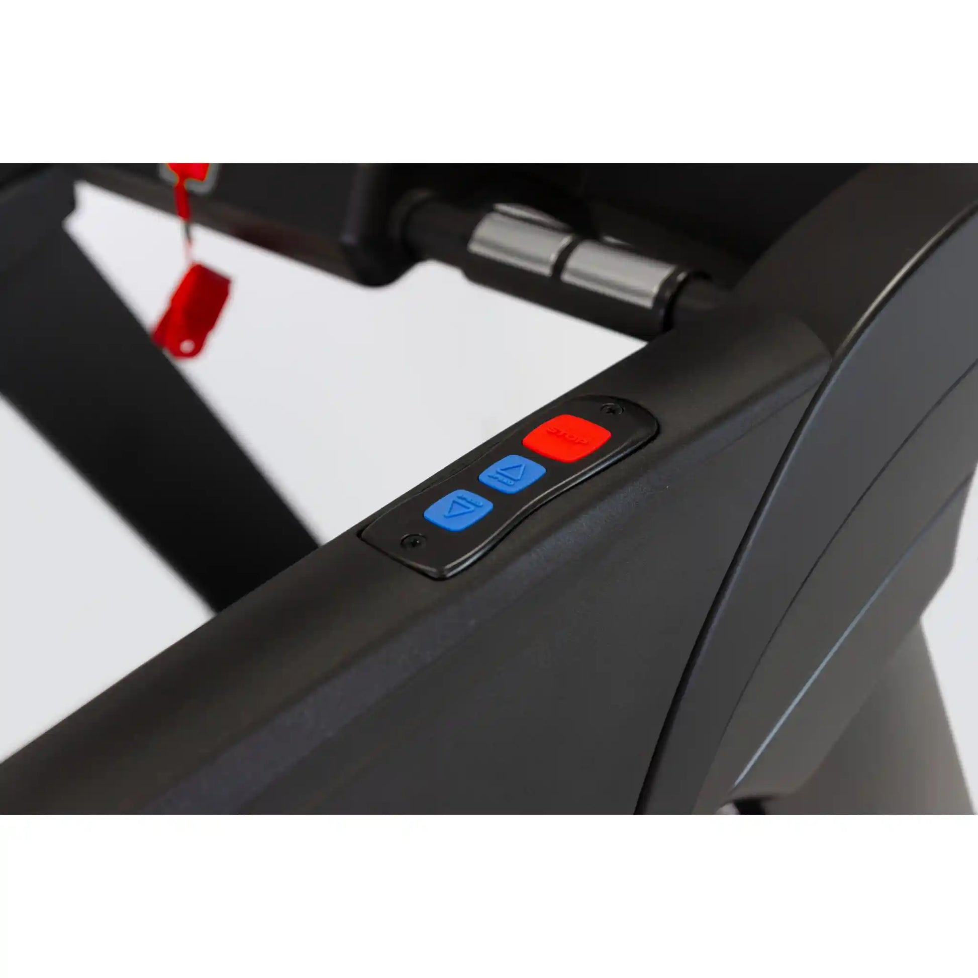 Close-up of a treadmill with control buttons on a white background