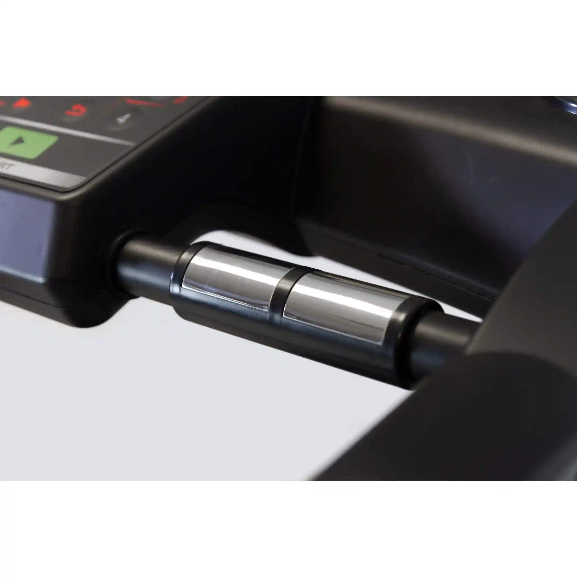 Close-up of metal sensors on atreadmill with a blurred background