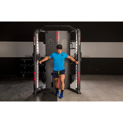 Person using pulley system on a multi gym in a gym setting