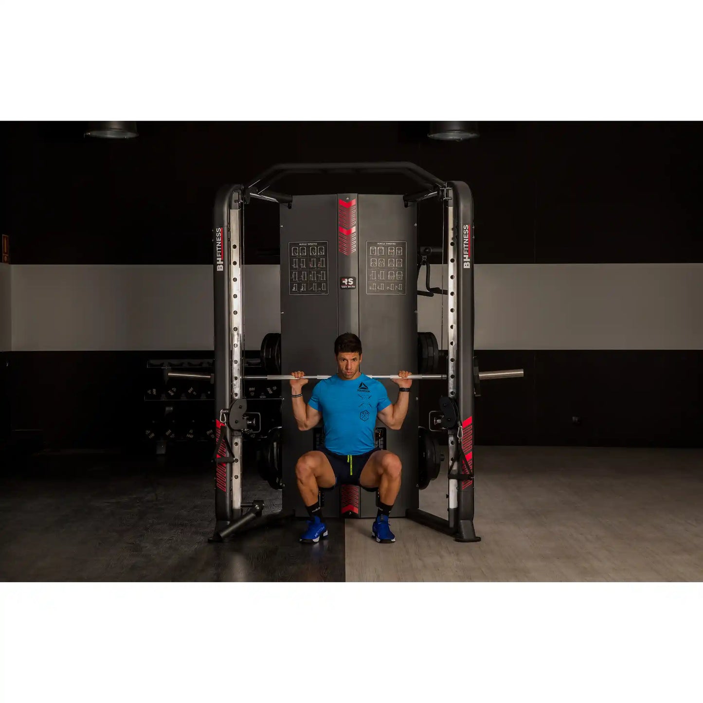 Person using a weightlifting machine in a gym setting